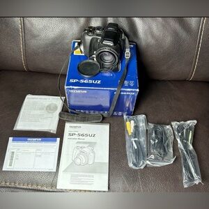 Olympus SP-565UZ 10MP Digital Camera W/ 20x Optical Zoom Works W/ Box & Manuals